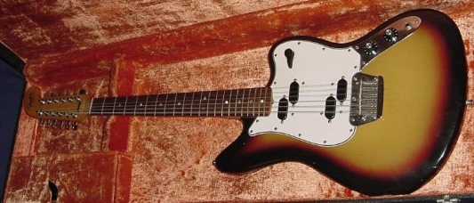 This is a vintage 1965 Fender Electric XII, sunburst. It has the “hockey” head. Great playing guitar for some parts. Some information from Wikipedia: (http://en.wikipedia.org/wiki/Fender_Electric_XII) The Fender Electric XII was a...